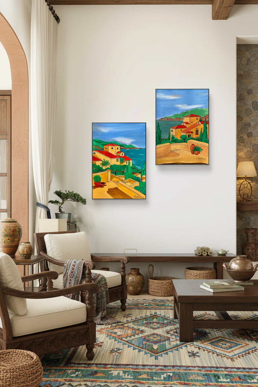 Two identical paintings of a village scene on a beige wall with decorative elements.